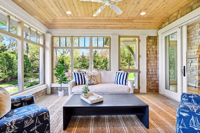 sunroom with wooden ceiling, recessed lighting, a ceiling fan, outdoor lounge area, and brick wall