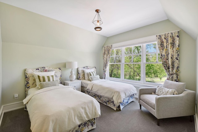 carpeted bedroom with vaulted ceiling