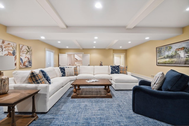 living area featuring beamed ceiling and recessed lighting