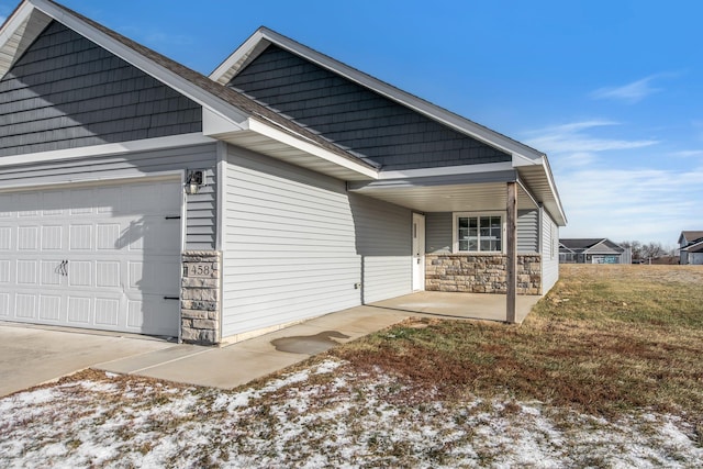 snow covered property featuring a garage