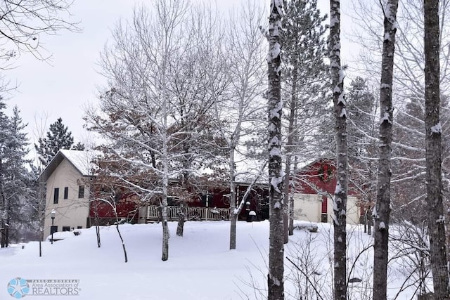 view of snow covered property