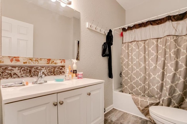 full bathroom with vanity, hardwood / wood-style flooring, toilet, and shower / bathtub combination with curtain