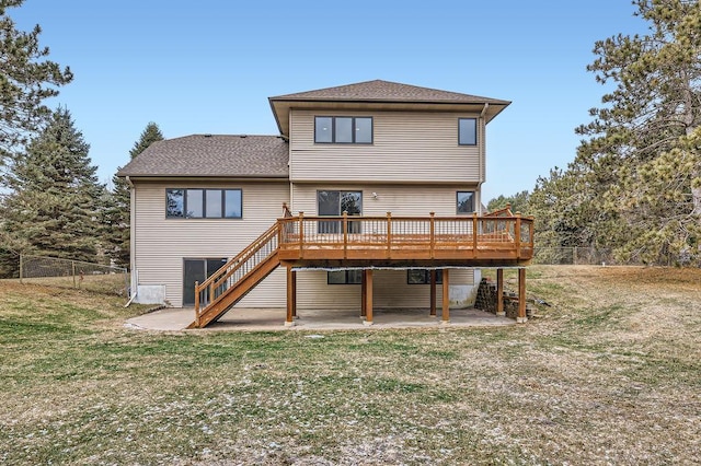 back of property featuring a patio, a yard, and a deck