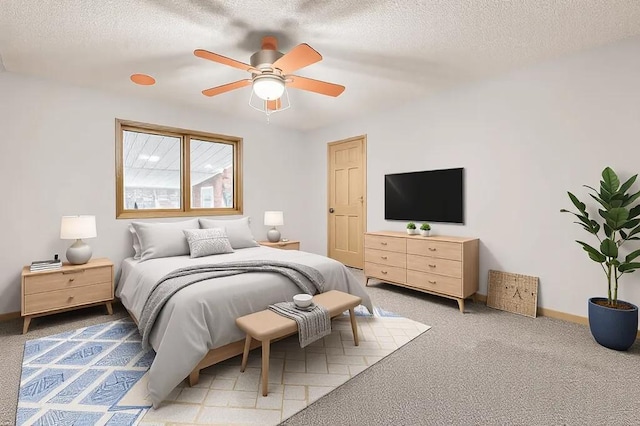 bedroom featuring ceiling fan, carpet flooring, and a textured ceiling