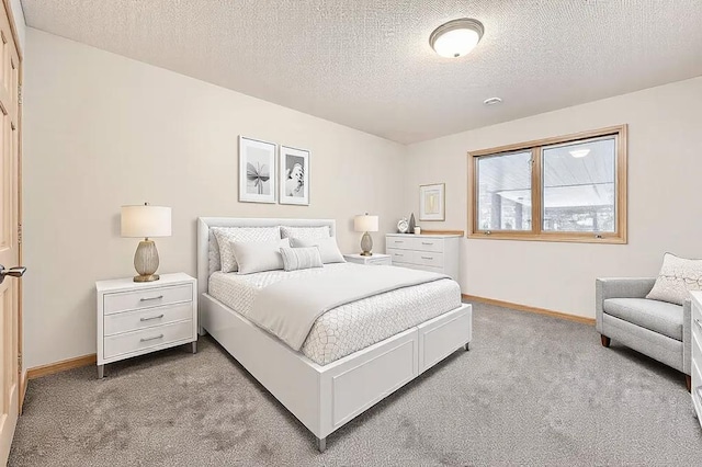 carpeted bedroom with a textured ceiling