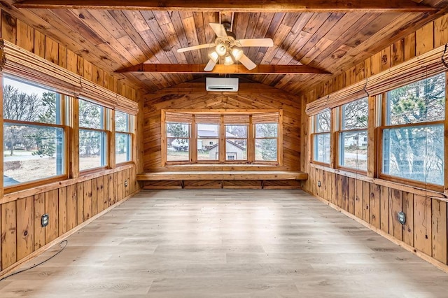 unfurnished sunroom with wood ceiling, lofted ceiling, and a healthy amount of sunlight