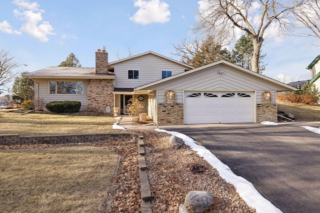 view of front facade with a garage and a front yard