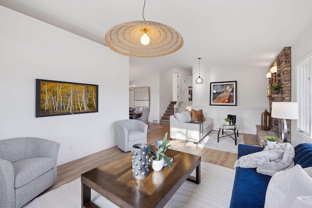 living room featuring hardwood / wood-style flooring and vaulted ceiling