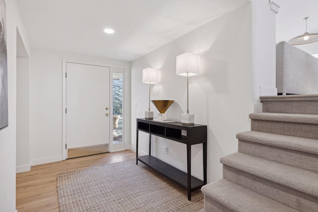 entryway with light hardwood / wood-style flooring