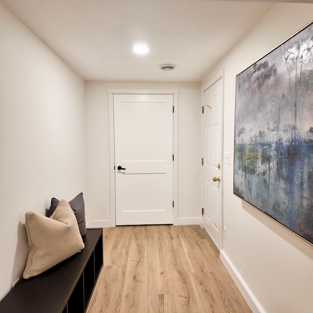 doorway to outside with light hardwood / wood-style floors