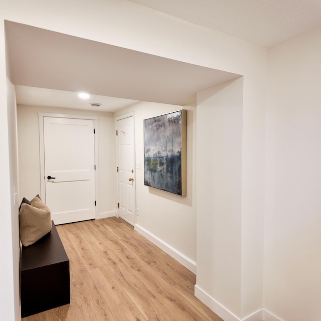 hallway featuring light wood-type flooring