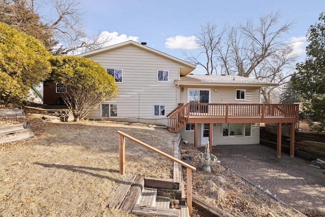 back of property featuring a deck