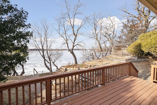 wooden deck featuring a water view