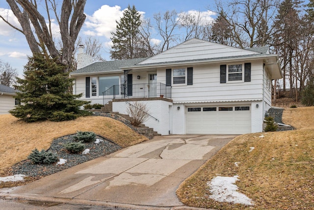 view of front of property with a chimney, a porch, stairway, an attached garage, and driveway