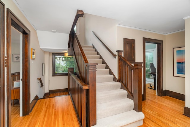 2328 3rd St, Duluth, MN 55812 - staircase with wood finished floors and ornamental molding