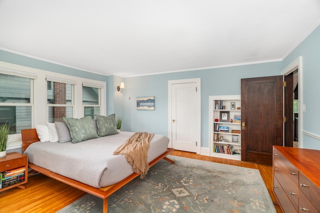 2328 3rd St, Duluth, MN 55812 - bedroom featuring wood finished floors and ornamental molding
