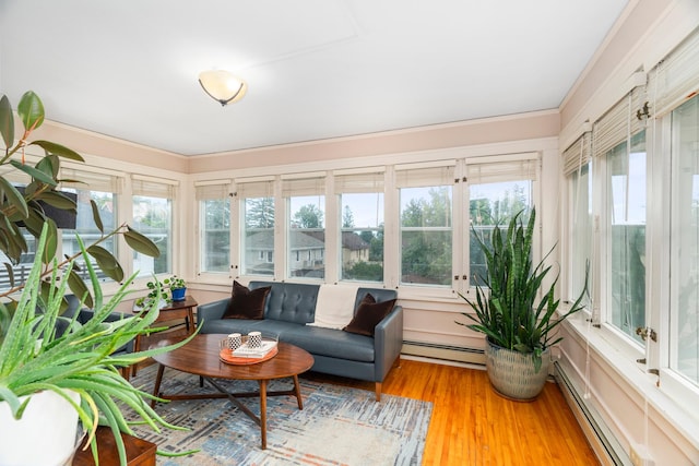 2328 3rd St, Duluth, MN 55812 - sunroom with a baseboard radiator, wood finished floors, and crown molding
