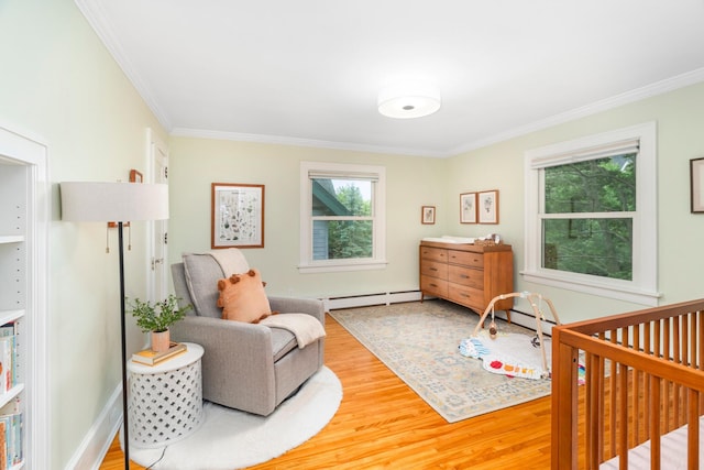 2328 3rd St, Duluth, MN 55812 - bedroom with crown molding, wood finished floors, a baseboard heating unit, and a baseboard radiator