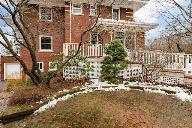 2328 3rd St, Duluth, MN 55812 - view of snowy exterior with brick siding