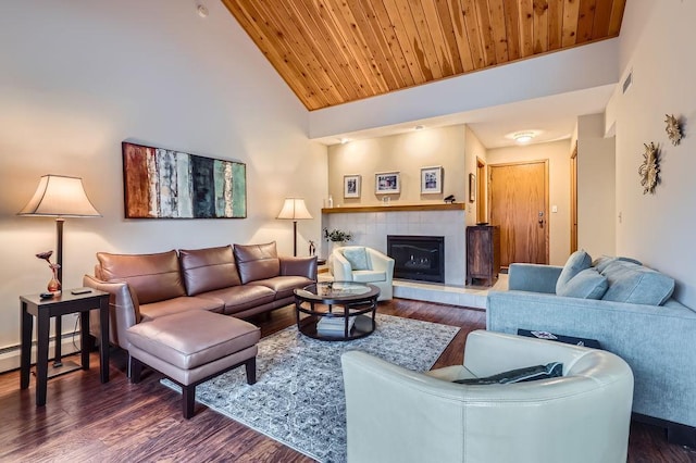 living area featuring wood ceiling, baseboard heating, and wood finished floors