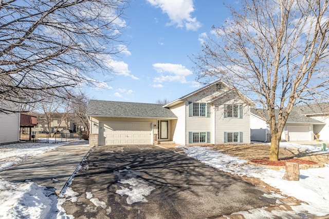 split level home with a garage