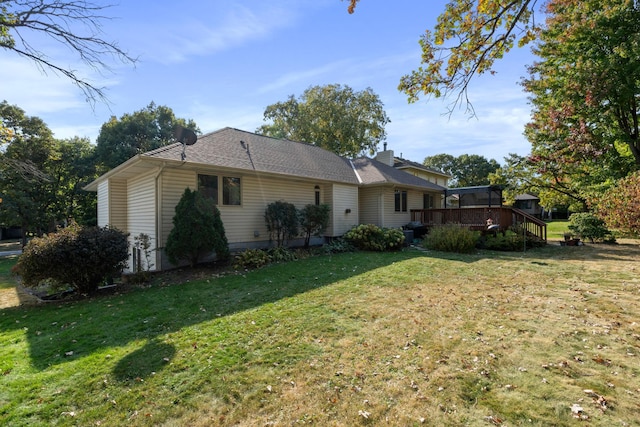 view of property exterior featuring a lawn and a deck