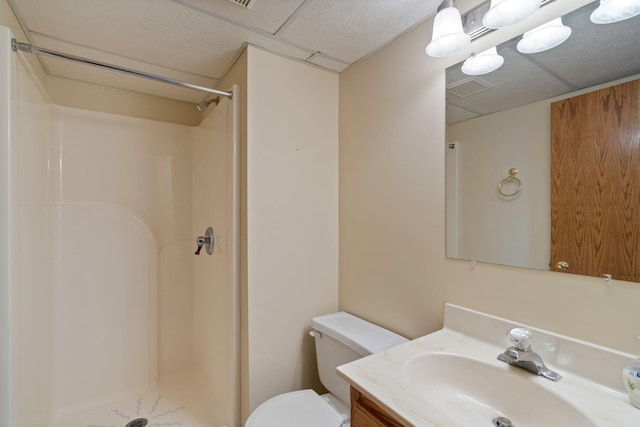 bathroom featuring vanity, toilet, and walk in shower