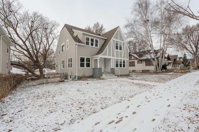 view of snow covered back of property