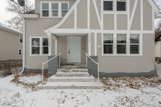 view of snow covered property entrance