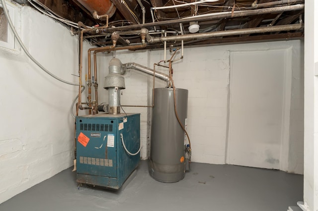 utility room featuring water heater