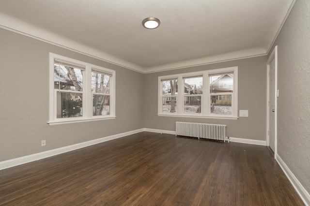 interior space with crown molding, radiator heating unit, dark wood-type flooring, and a textured ceiling