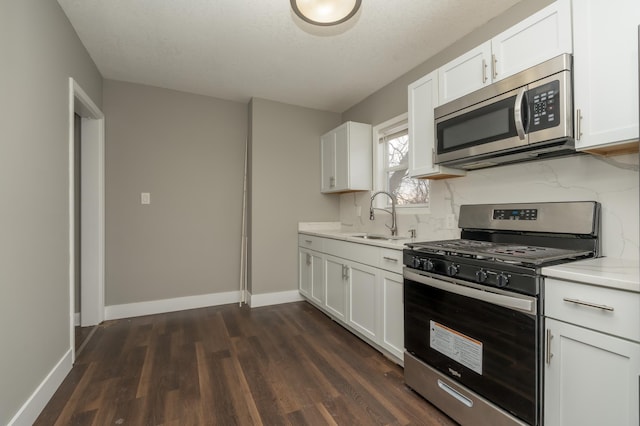 kitchen featuring white cabinetry and appliances with stainless steel finishes