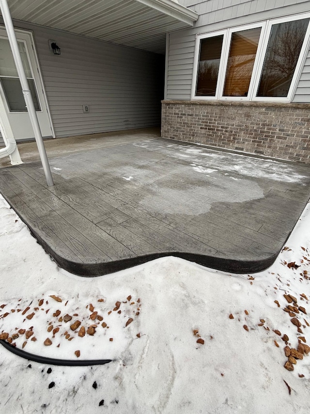 10 Townhouse Rd, Morris, MN 56267 - view of patio / terrace featuring a carport