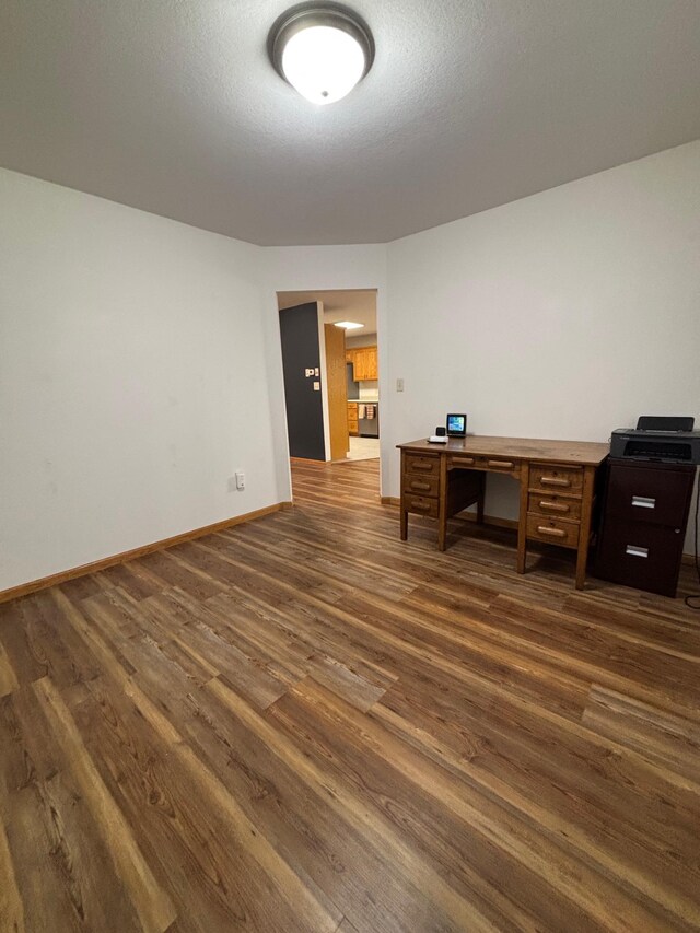 10 Townhouse Rd, Morris, MN 56267 - unfurnished office with dark wood finished floors and baseboards