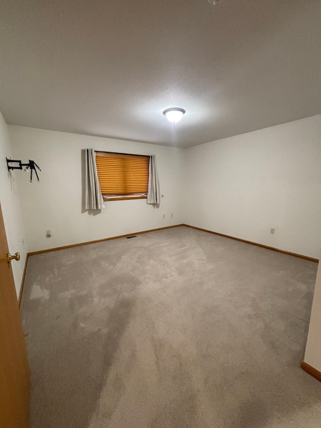 10 Townhouse Rd, Morris, MN 56267 - unfurnished room with baseboards and carpet flooring
