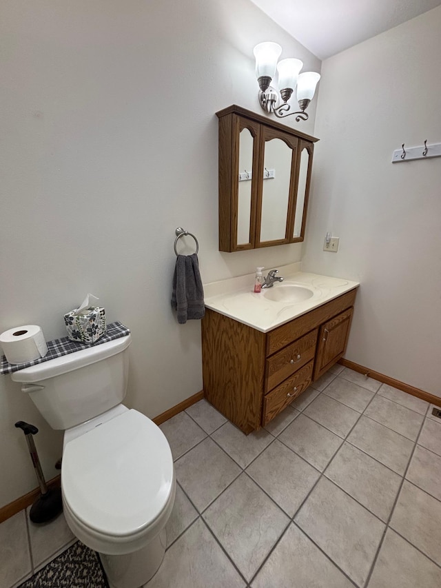 10 Townhouse Rd, Morris, MN 56267 - bathroom with baseboards, toilet, vanity, a chandelier, and tile patterned flooring