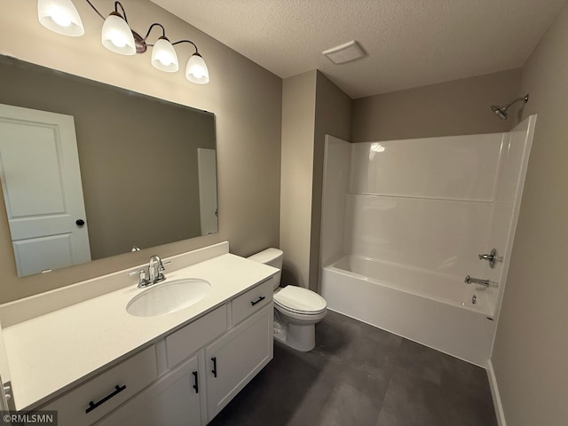 full bathroom featuring vanity, washtub / shower combination, a textured ceiling, and toilet