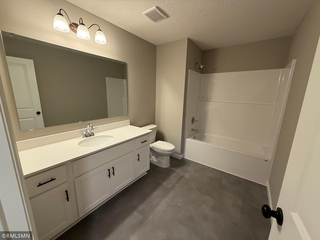 full bathroom with washtub / shower combination, vanity, a textured ceiling, and toilet