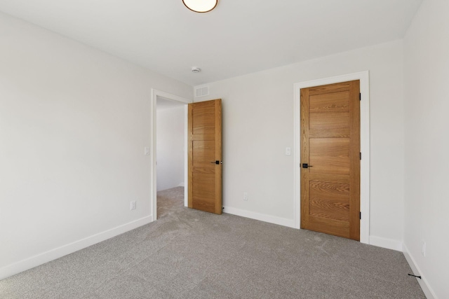 spare room with carpet floors