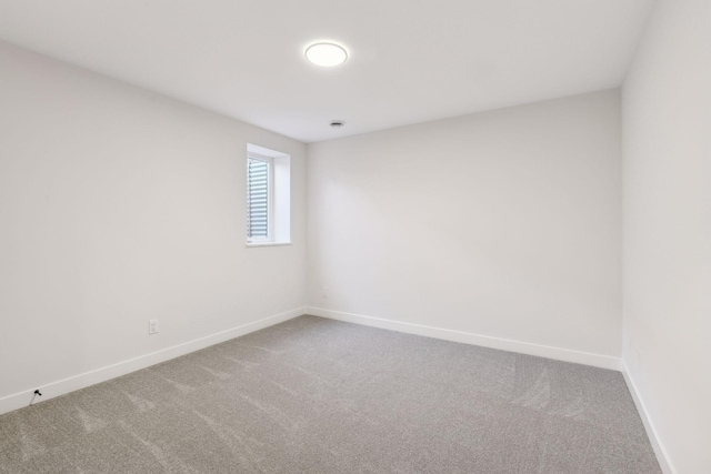 unfurnished room with carpet flooring