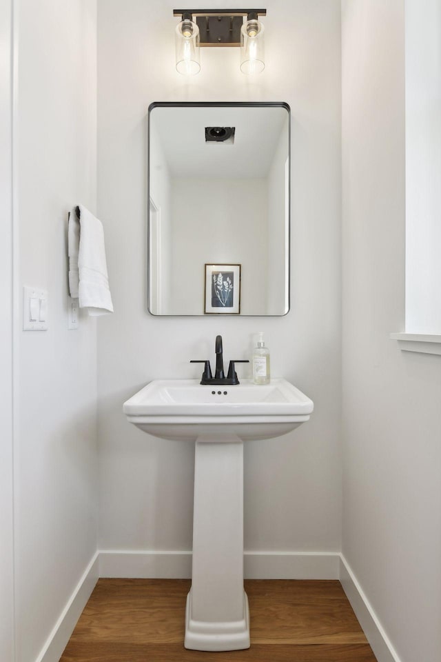 bathroom featuring hardwood / wood-style flooring and sink