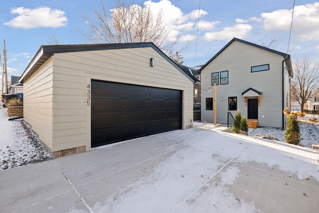 view of front of property featuring an outbuilding and a garage