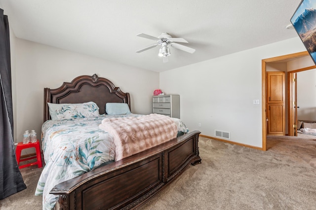 bedroom with light carpet and ceiling fan