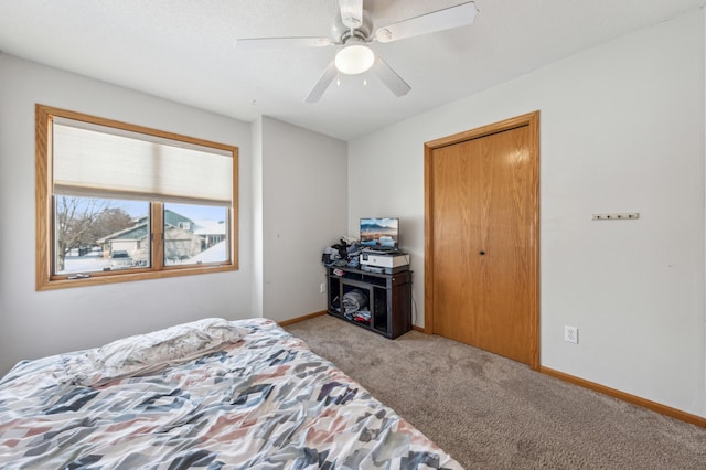 bedroom featuring light carpet and ceiling fan