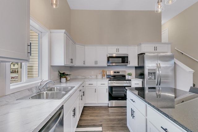 kitchen with white cabinets, stainless steel appliances, and sink