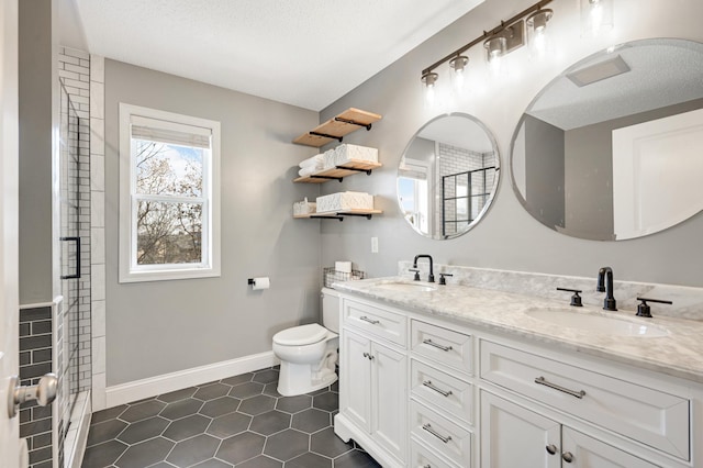 bathroom with vanity, tile patterned flooring, toilet, a textured ceiling, and a shower with shower door