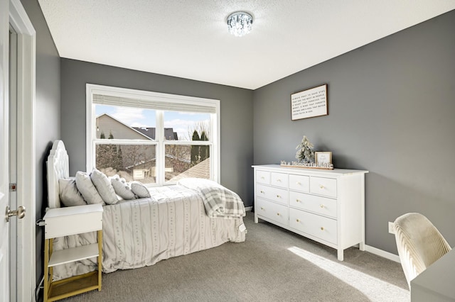 carpeted bedroom with a textured ceiling