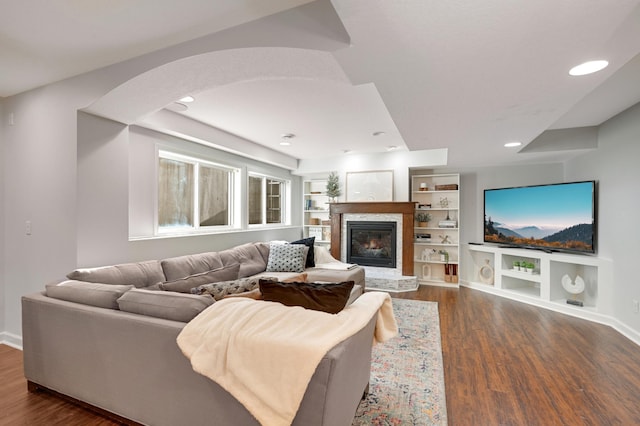 living room with dark hardwood / wood-style flooring