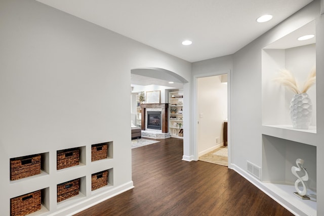 hall with dark wood-type flooring