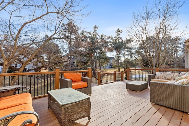 wooden terrace featuring an outdoor hangout area